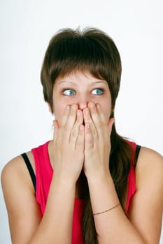 frightened she closes her mouth her ​​hands