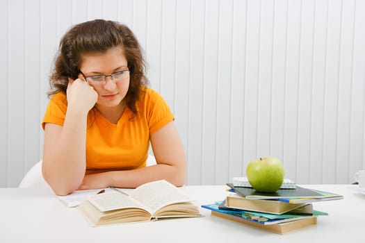 tired girl student with books and notebooks