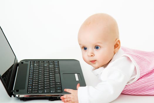 little kid in the studio with a laptop