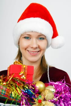 Portrait of a smiling attractive young woman with Christmas decorations