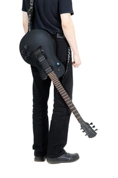 performer with an electric guitar in black. View from the back