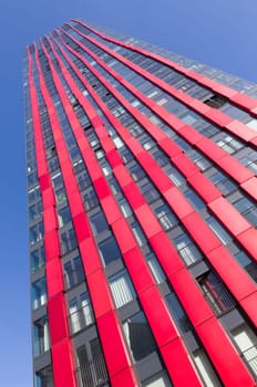 exterior of the 'red apple', a modern residential tower in Rotterdam. Designed by KCAP architects (exterior) and Jan des Bouvrie (interior), the 120 tall building counts 39 floors.