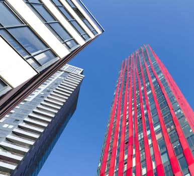 exterior of the 'red apple', a modern residential tower in Rotterdam. Designed by KCAP architects (exterior) and Jan des Bouvrie (interior), the 120 tall building counts 39 floors.