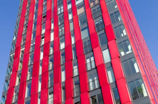 exterior of the 'red apple', a modern residential tower in Rotterdam. Designed by KCAP architects (exterior) and Jan des Bouvrie (interior), the 120 tall building counts 39 floors.