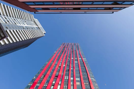 exterior of the 'red apple', a modern residential tower in Rotterdam. Designed by KCAP architects (exterior) and Jan des Bouvrie (interior), the 120 tall building counts 39 floors.