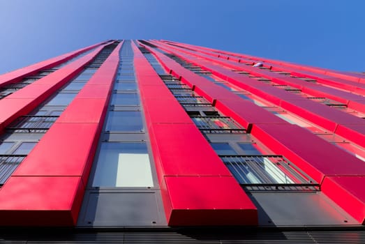 exterior of the 'red apple', a modern residential tower in Rotterdam. Designed by KCAP architects (exterior) and Jan des Bouvrie (interior), the 120 tall building counts 39 floors.