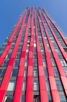 exterior of the 'red apple', a modern residential tower in Rotterdam. Designed by KCAP architects (exterior) and Jan des Bouvrie (interior), the 120 tall building counts 39 floors.