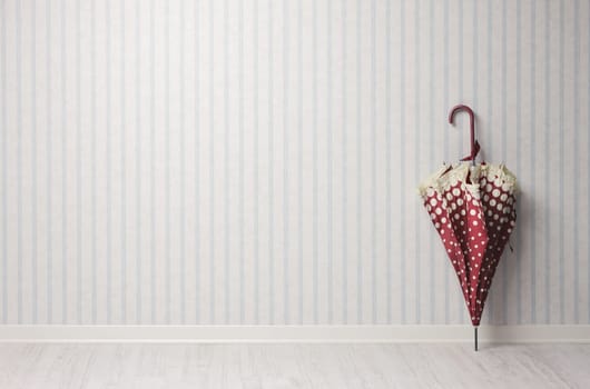 Umbrella in an empty room on vintage wallpaper