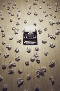office of a journalist or author with an old typewriter on wooden floor