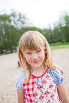 Closeup of smiling cute young girl at beach
