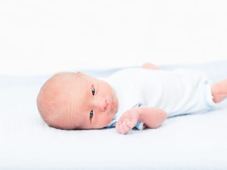 Cute beautiful newborn baby is laying down