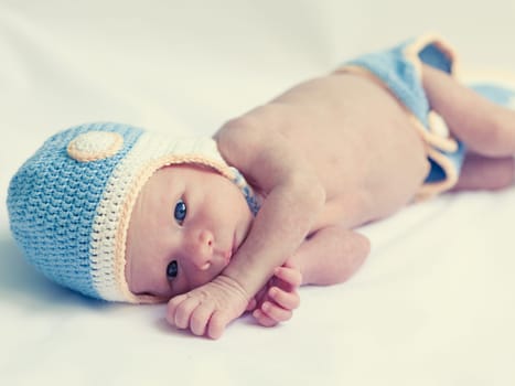 Cute beautiful baby is wearing a funny hat