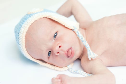 Cute beautiful baby is wearing a funny hat