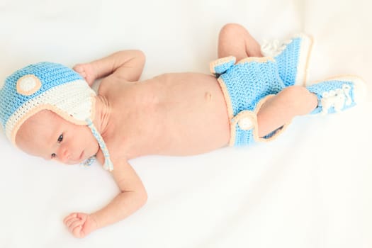 Cute beautiful baby is wearing a funny hat