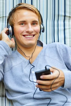 Teenager relaxing and listening to tunes.