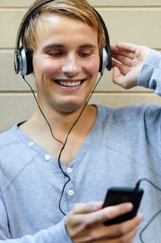 Handsome young man getting into the groove