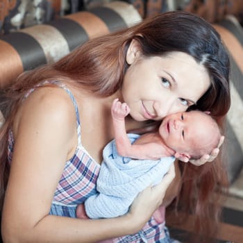 Mother is holding newborn baby