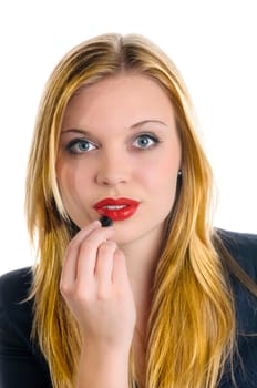A young girl with long blond hair wearing on with a red lipstick on her lips, she smiles at the camera while isolated against white background.