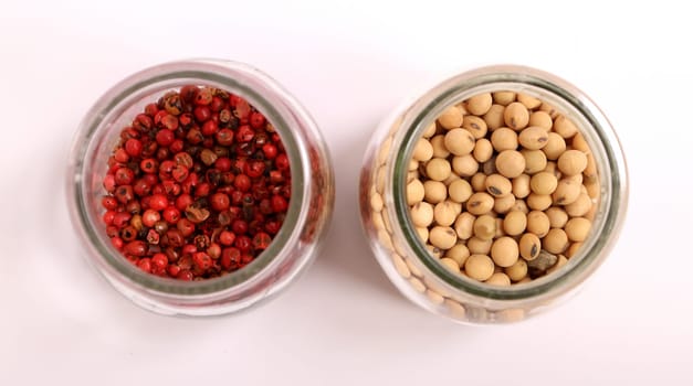 Variety of spices in a glass pot..