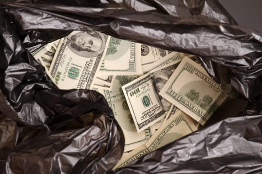 A Rubbish bag full of dollars .
