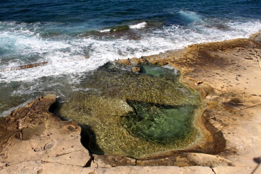 Rocky natural pools in the beach.