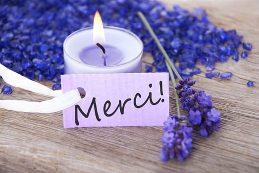 a purple label with the french word merci which means thanks and a recreational background