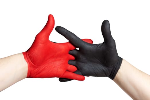a red and a black painted hand handshaking, isolated