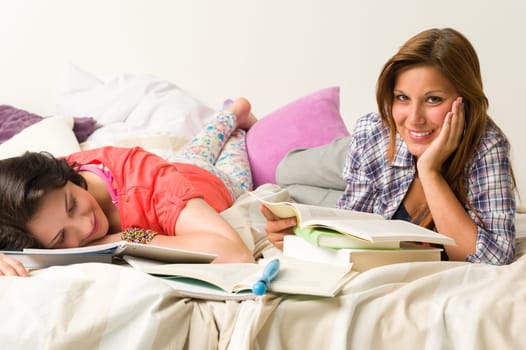 Young caucasian girls studying at home