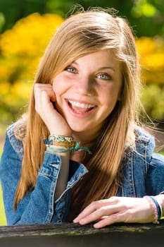 Portrait of charming happy young girl on sunny day