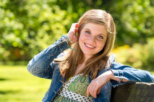 Carefree young woman enjoying sunshine outside fresh air springtime