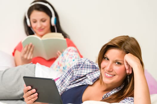 Best friends resting and reading in their room