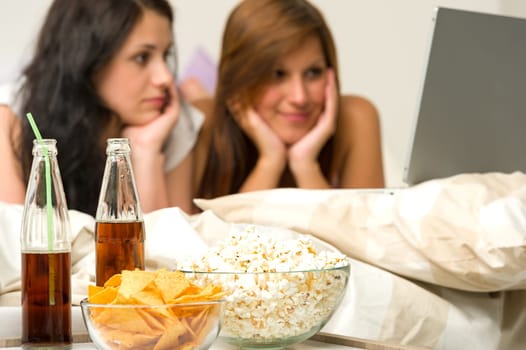Young girls having slumber party and watching movies