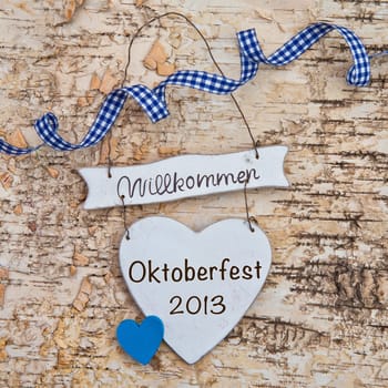 Heart with checkered bow on birch bark background