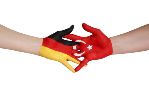 a close handshake between germany and turkey symbolizing partnership