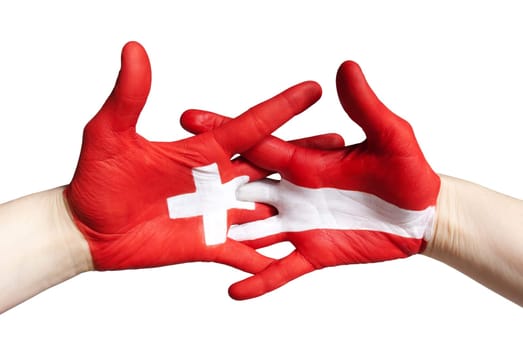 hands symbolizing partnership between switzerland and austria