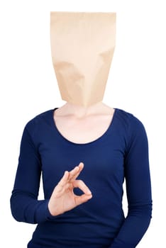 a person with a blank paper bag head with copy space showing an okay sign