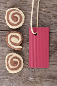a red banner with free space and cookies on wood as background