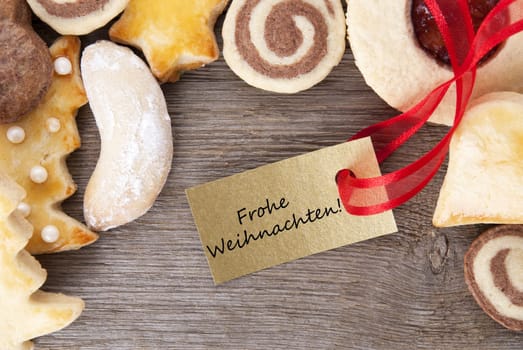a christmas cookie background with the german words Frohe Weihnachten which means merry christmas