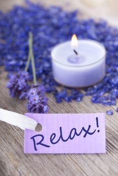 the word relax on a purple label with recreation background