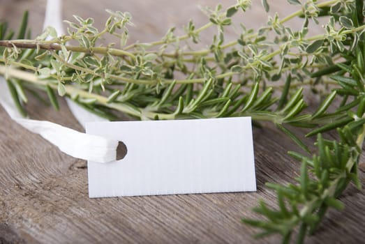 a white label with copy space and herbs in the background