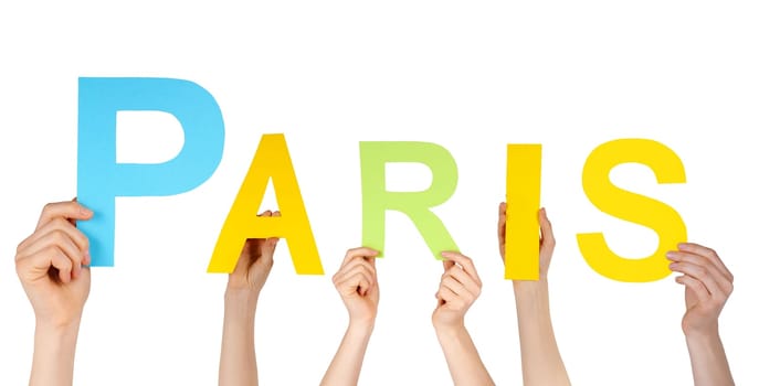 many hands holding the name of the french capital Paris, isolated