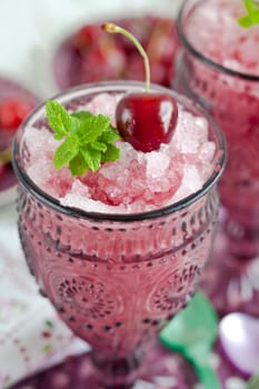 Sorbet with cherry and fresh mint leaves