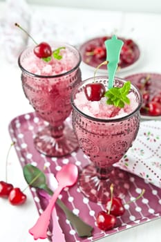 Two glasses with sorbet with cherry flavor and minze