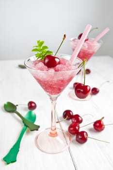 Cherry sorbet with fresh cherries and mint in glasses