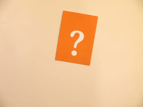Orange card with a question mark on a bright background