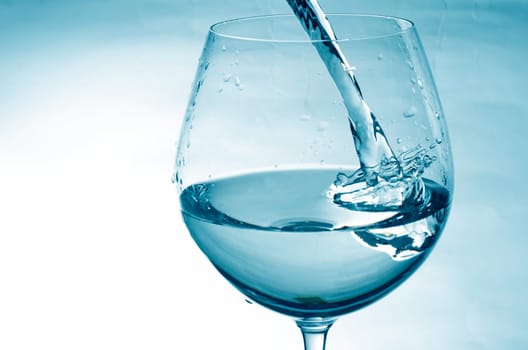 Pouring fresh water in blue