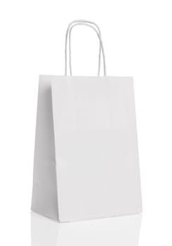 White paper shopping bag isolated with reflection