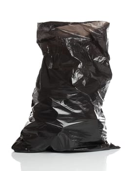 Black garbage bag isolated over white bacground