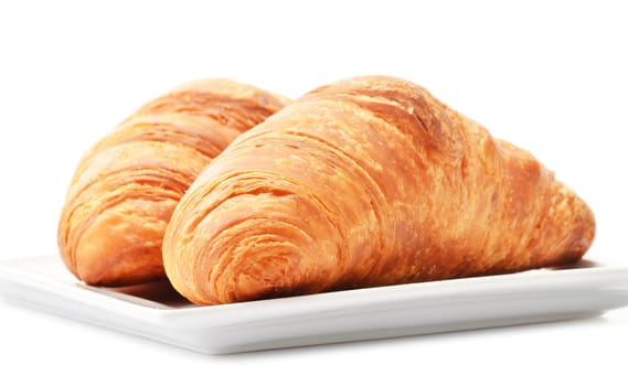 Fresh croissants isolated on white background