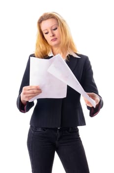 Attractive young woman with long blond hair in a business outfit reads a document,isolated against a white background.